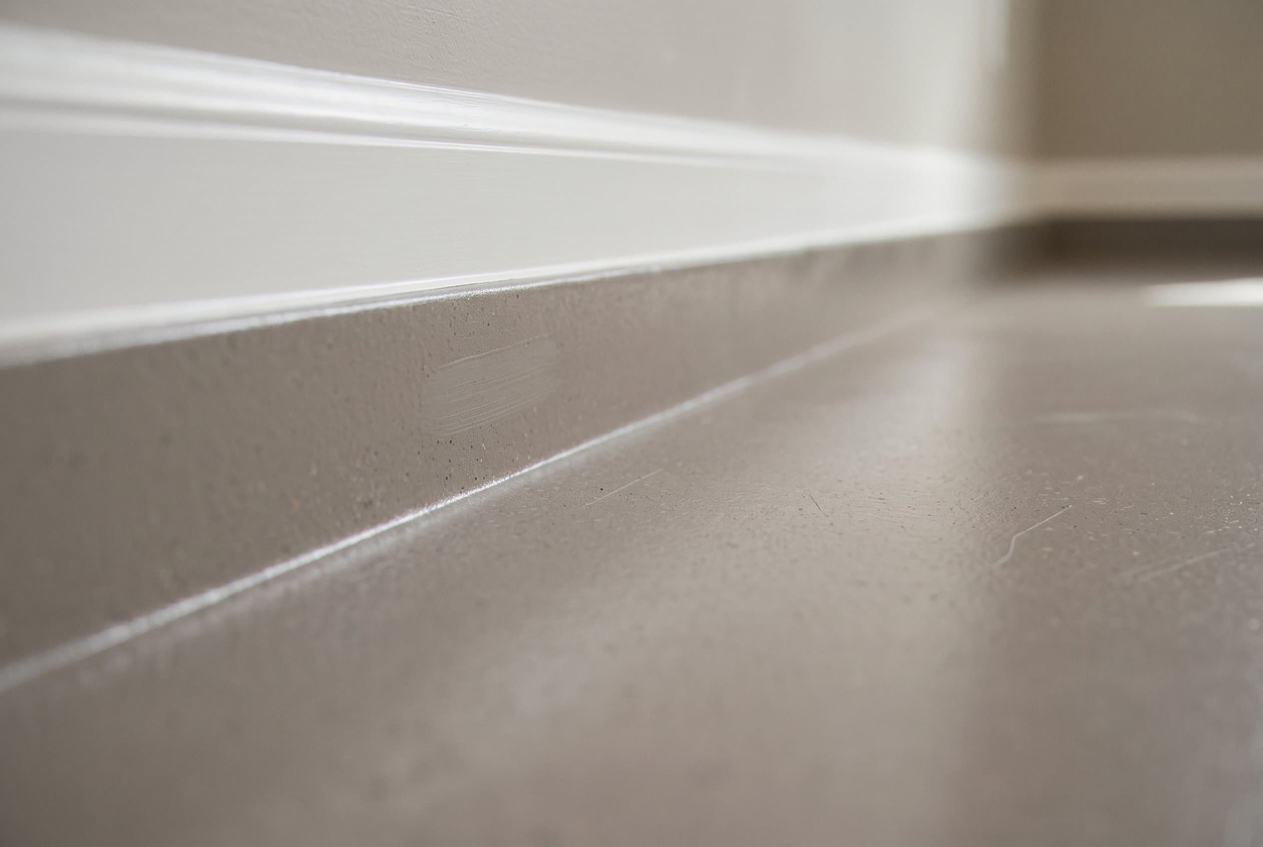 Coved edge where basement floor meets the wall.